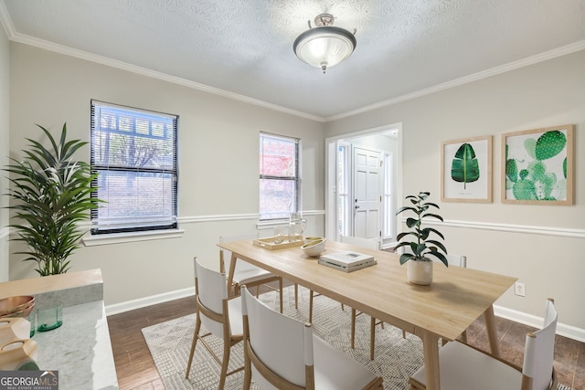 dining space with a textured ceiling, dark hardwood / wood-style floors, and ornamental molding