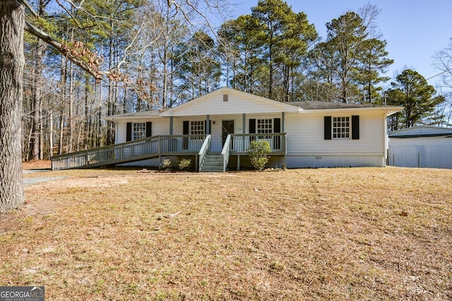 ranch-style house featuring a front lawn and a porch