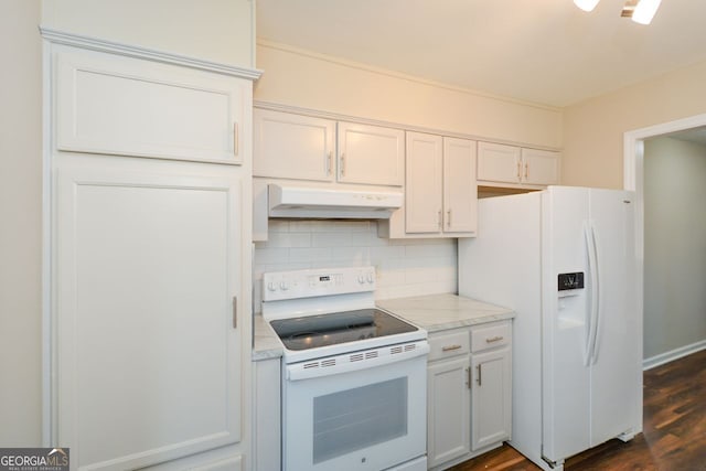 kitchen with white appliances, white cabinets, dark hardwood / wood-style flooring, tasteful backsplash, and light stone counters