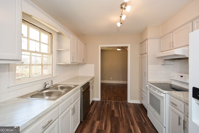 kitchen with white appliances, white cabinetry, dark hardwood / wood-style flooring, decorative backsplash, and sink