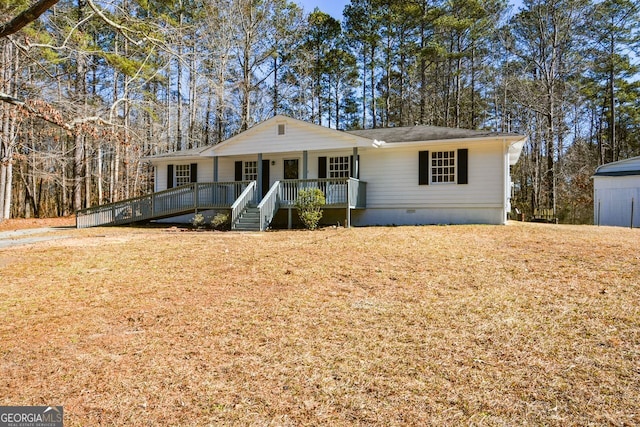 single story home with covered porch and a front yard