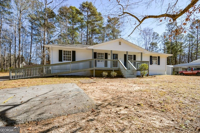 single story home featuring a porch