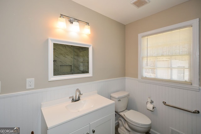 bathroom featuring toilet and vanity