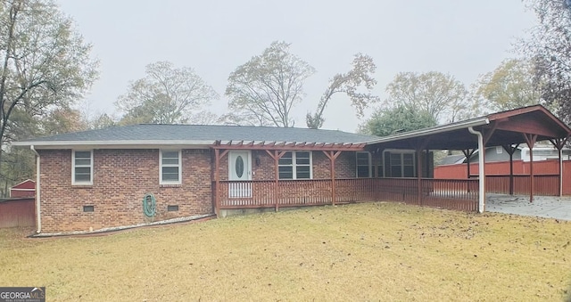 rear view of property with a yard