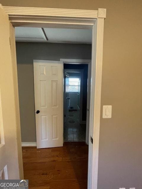 hall with dark hardwood / wood-style floors