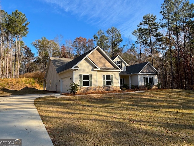 view of front of home featuring a garage and a front lawn