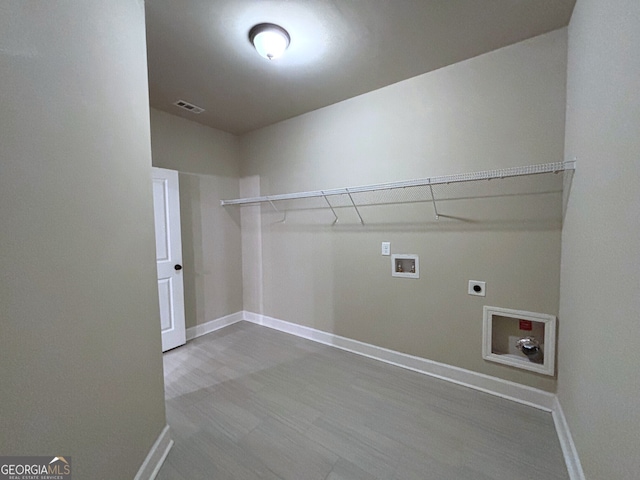 laundry room with hookup for an electric dryer and hookup for a washing machine