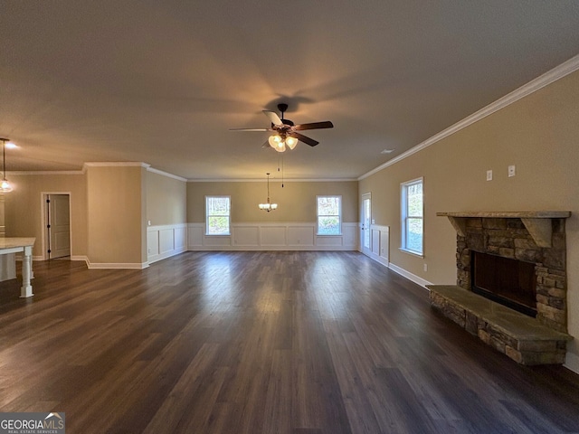 unfurnished living room featuring a fireplace, dark hardwood / wood-style flooring, ceiling fan, and ornamental molding