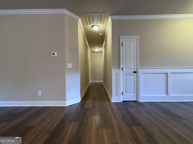 corridor featuring dark hardwood / wood-style floors and ornamental molding