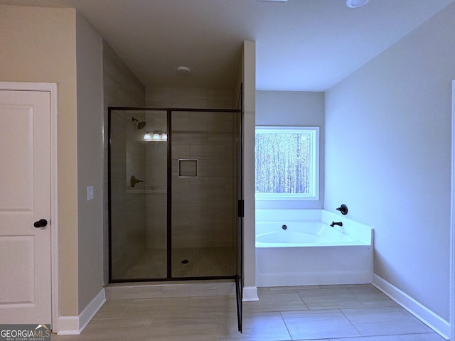 bathroom with tile patterned flooring and plus walk in shower