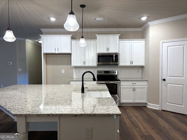 kitchen featuring light stone counters, stainless steel appliances, decorative light fixtures, white cabinets, and dark hardwood / wood-style floors