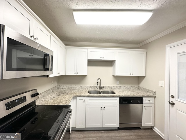 kitchen with sink, white cabinetry, and stainless steel appliances