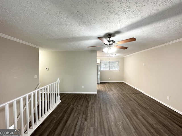 unfurnished room featuring a textured ceiling, crown molding, and dark wood-type flooring