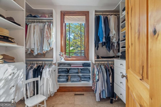 spacious closet featuring light tile patterned flooring