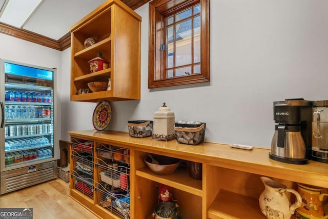 interior space featuring ornamental molding and hardwood / wood-style flooring