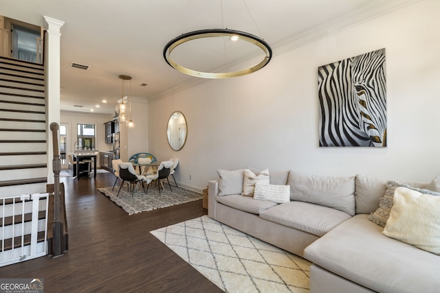 living room featuring ornamental molding and hardwood / wood-style flooring