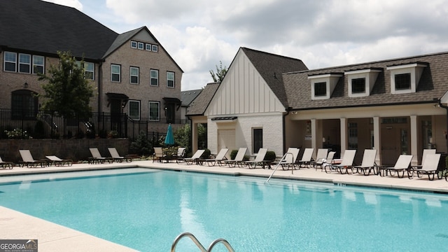 view of swimming pool with a patio area