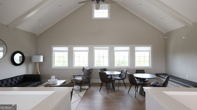 interior space with beam ceiling, hardwood / wood-style flooring, high vaulted ceiling, and ceiling fan