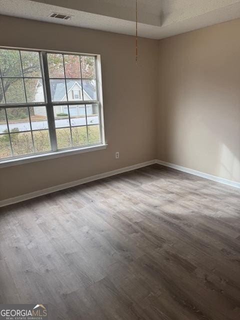 empty room featuring hardwood / wood-style flooring