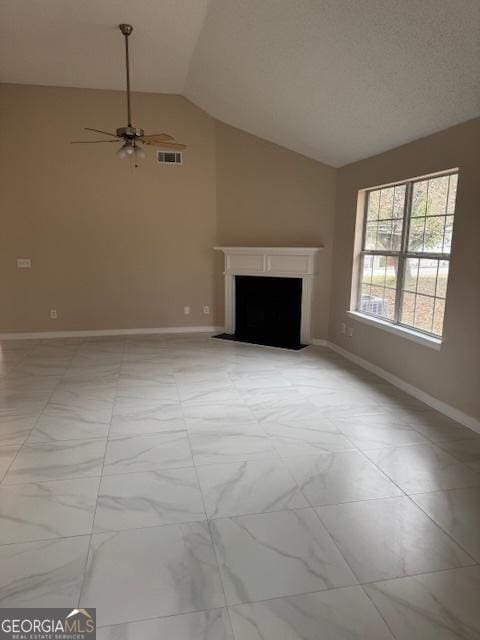 unfurnished living room with ceiling fan and lofted ceiling