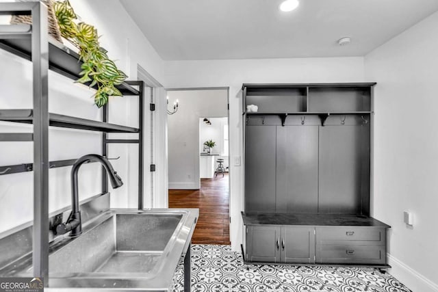 mudroom featuring light hardwood / wood-style floors and sink