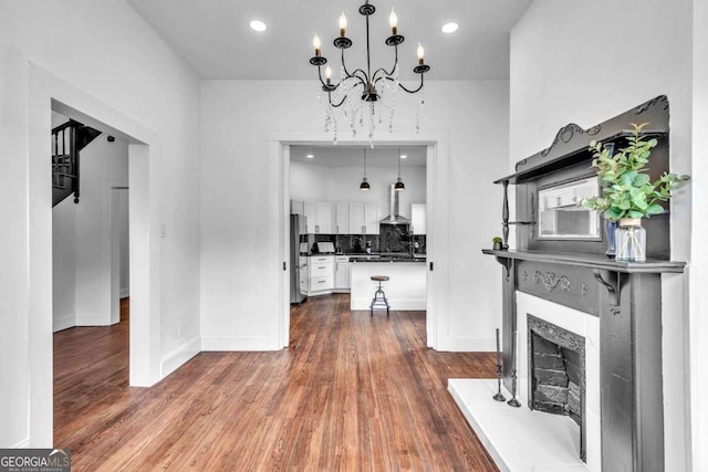 living room with a chandelier and hardwood / wood-style floors