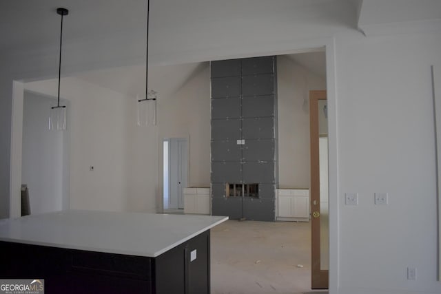 kitchen featuring decorative light fixtures and a tiled fireplace