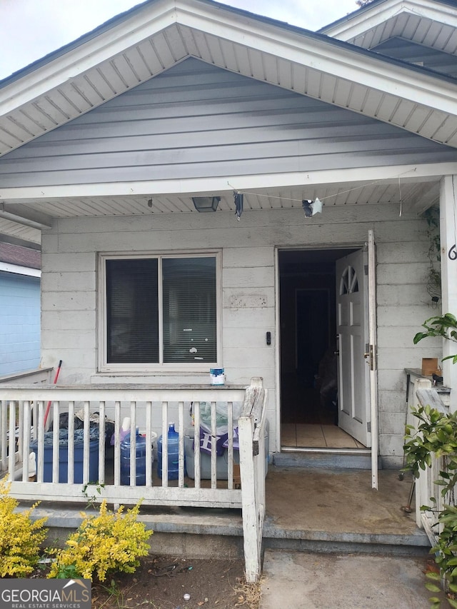 entrance to property with a porch