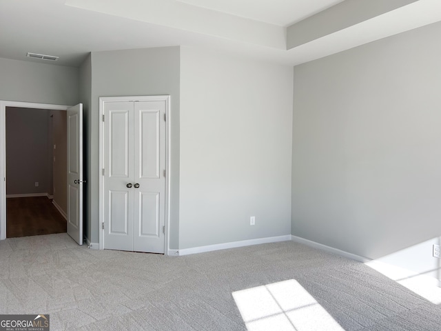 interior space featuring light carpet