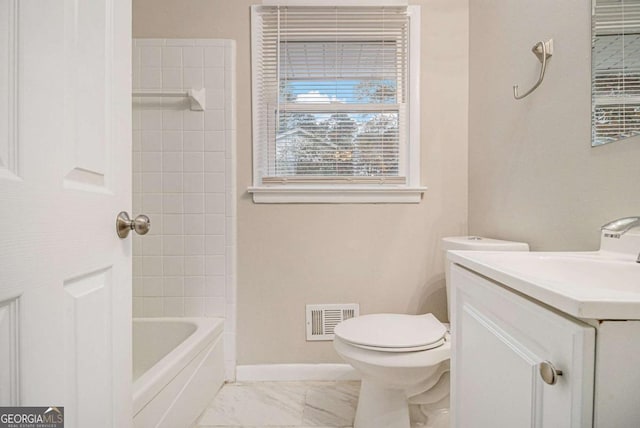 full bathroom with vanity, toilet, and tiled shower / bath combo