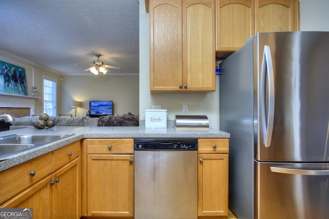 kitchen with ceiling fan, light brown cabinetry, and appliances with stainless steel finishes