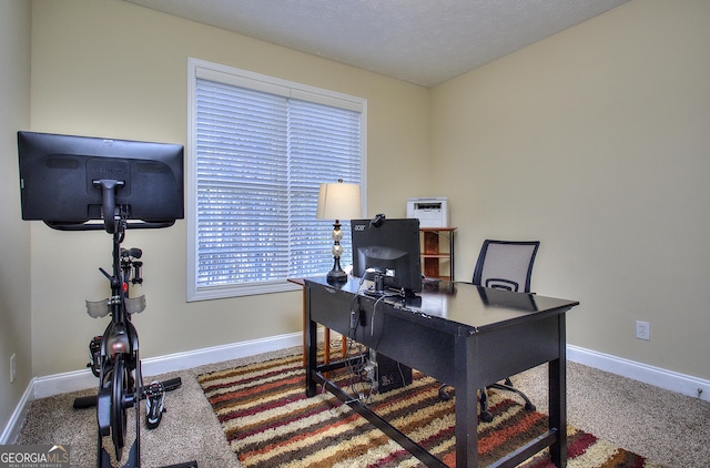 office area with carpet and a textured ceiling