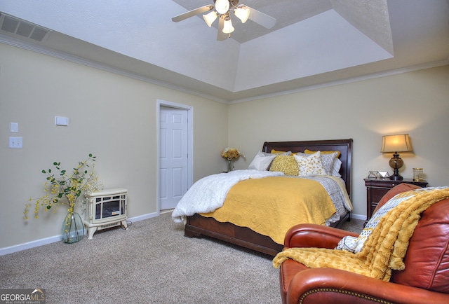 carpeted bedroom featuring a raised ceiling, ceiling fan, and crown molding