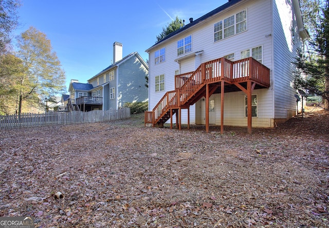 rear view of house featuring a deck