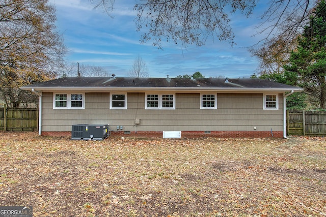 back of property with central AC