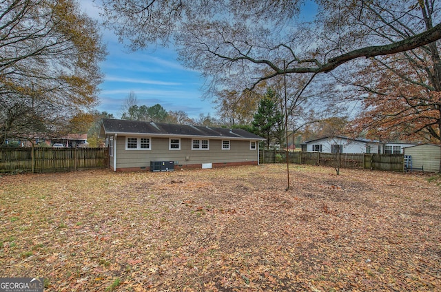 back of house featuring central AC