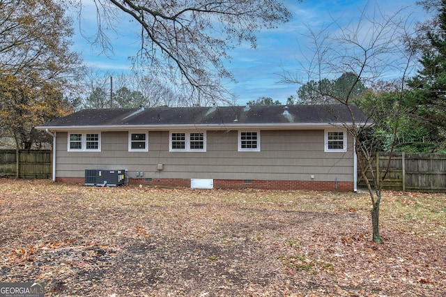 back of house with central AC