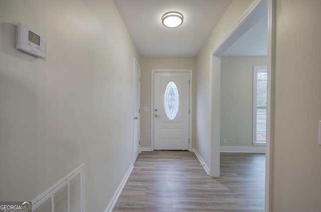 entryway with light hardwood / wood-style flooring