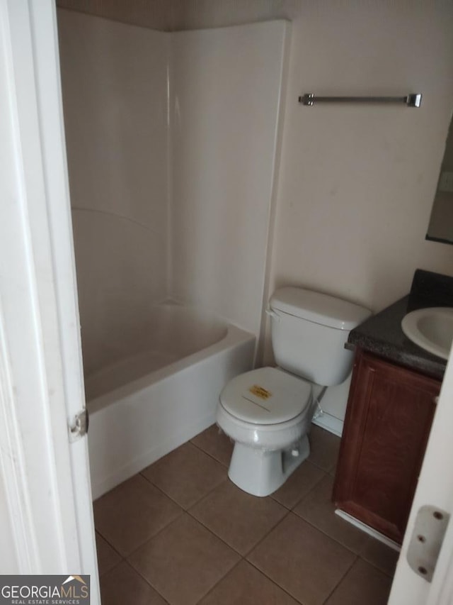 full bathroom featuring tile patterned floors, vanity, shower / bathtub combination, and toilet