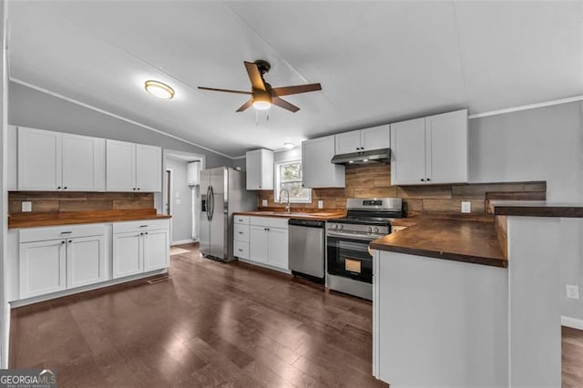 kitchen with stainless steel appliances, white cabinetry, lofted ceiling, and sink