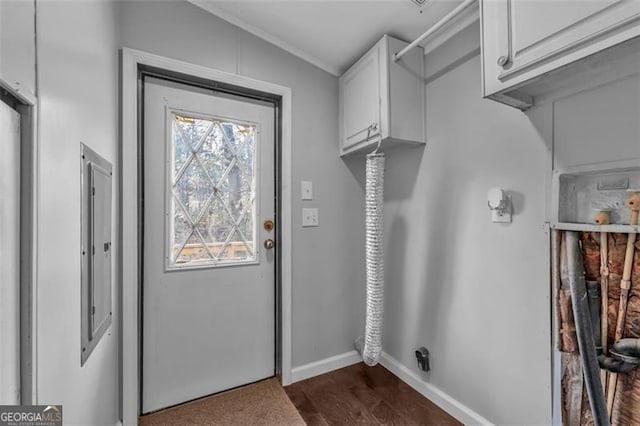 washroom with dark wood-type flooring, cabinets, and hookup for an electric dryer