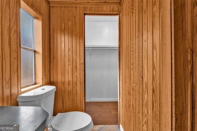 bathroom with wooden walls