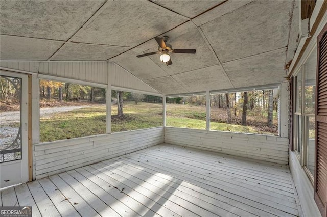 unfurnished sunroom with ceiling fan and lofted ceiling