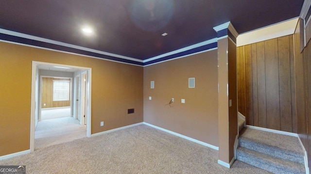 carpeted empty room with ornamental molding