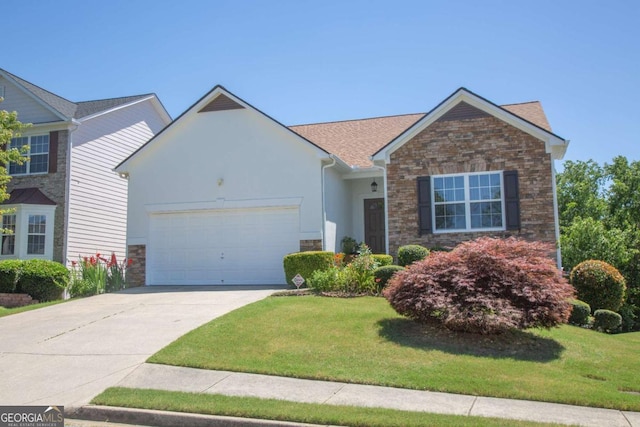 view of front facade featuring a front yard and a garage