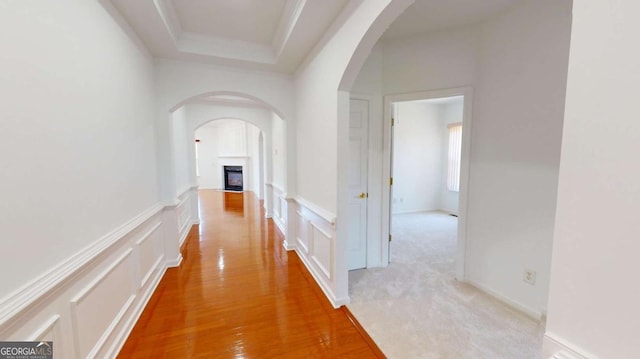 hallway with light colored carpet