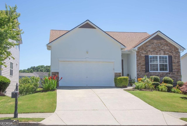 view of front of property with a garage and a front yard