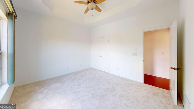 carpeted empty room with ceiling fan