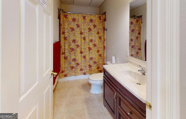 bathroom with a shower with curtain, vanity, toilet, and tile patterned flooring