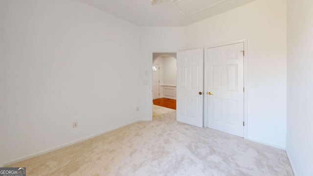 unfurnished bedroom with light carpet